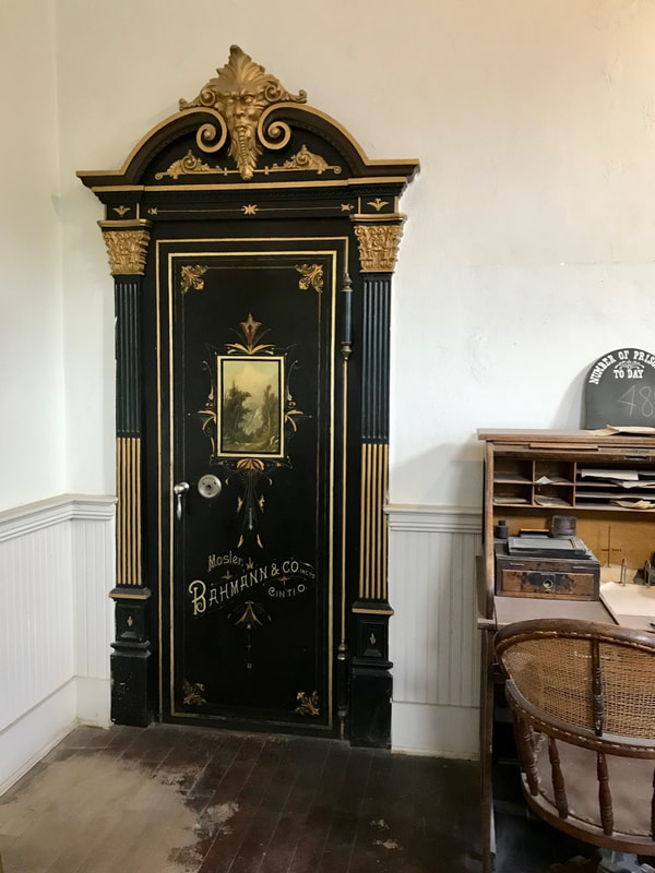 Large, ornate 19th-century safe, approximately the size of a doorway.